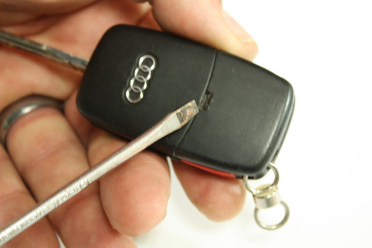 Use a screwdriver to open the battery compartment